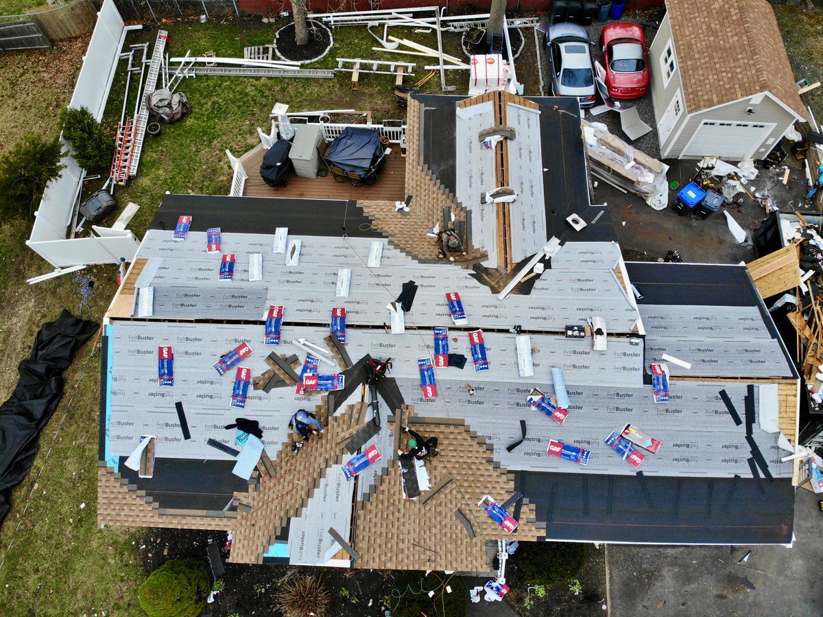 Crew installing GAF architectural shingles